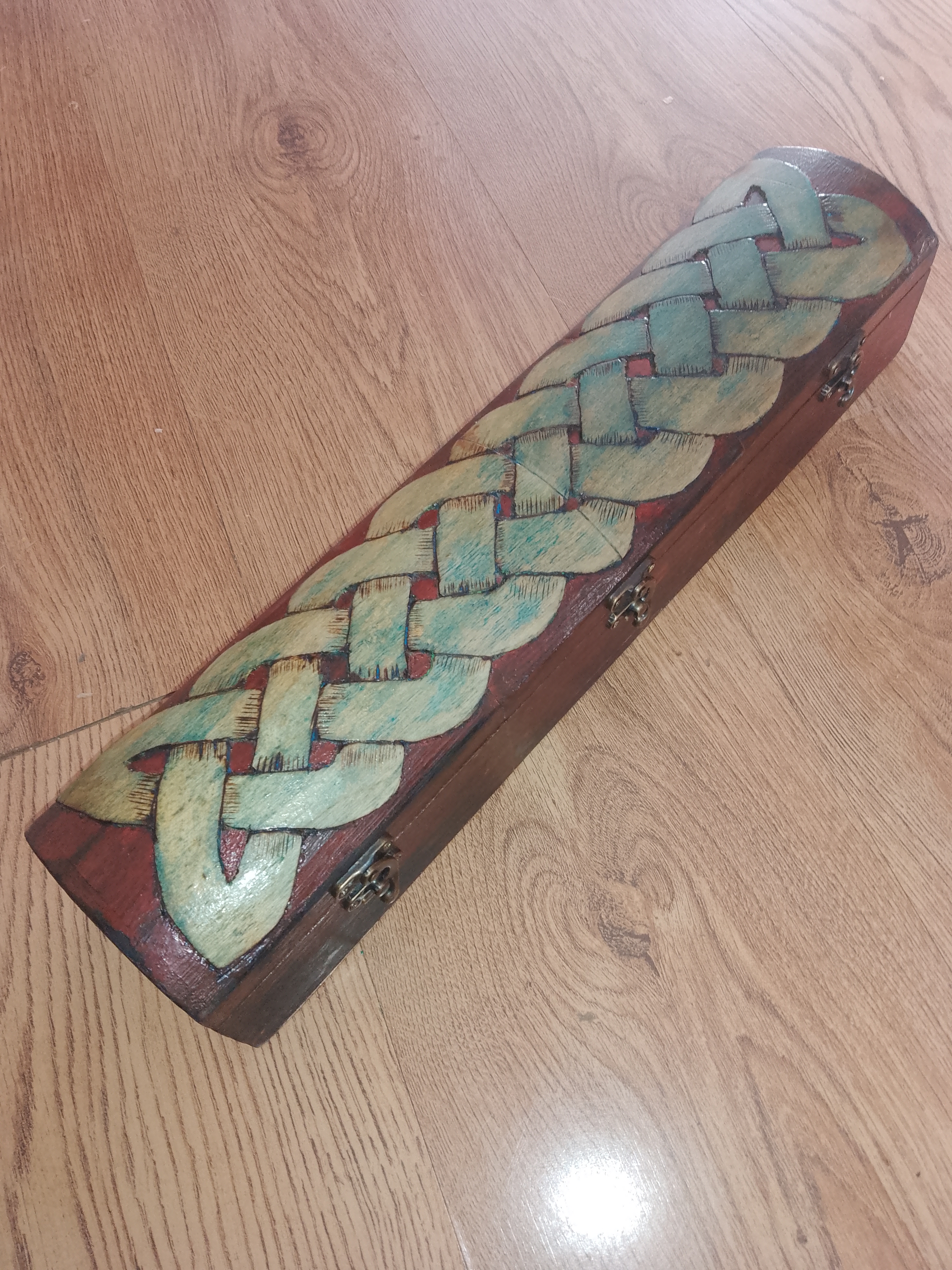 Hand carved custom Drumsticks in a Celtic Design box.