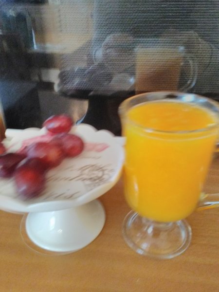 Freshly Squeezed Glass Of Orange Juice From One Orange